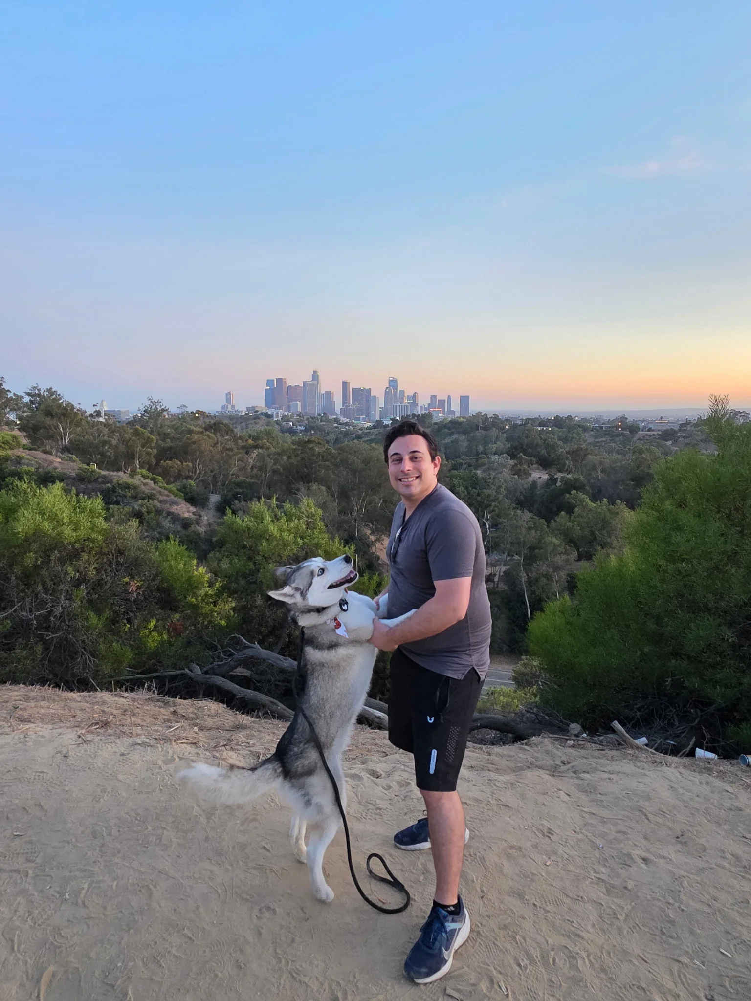 Joshua Segeren and Luke on a trail overlooking Los Angeles.